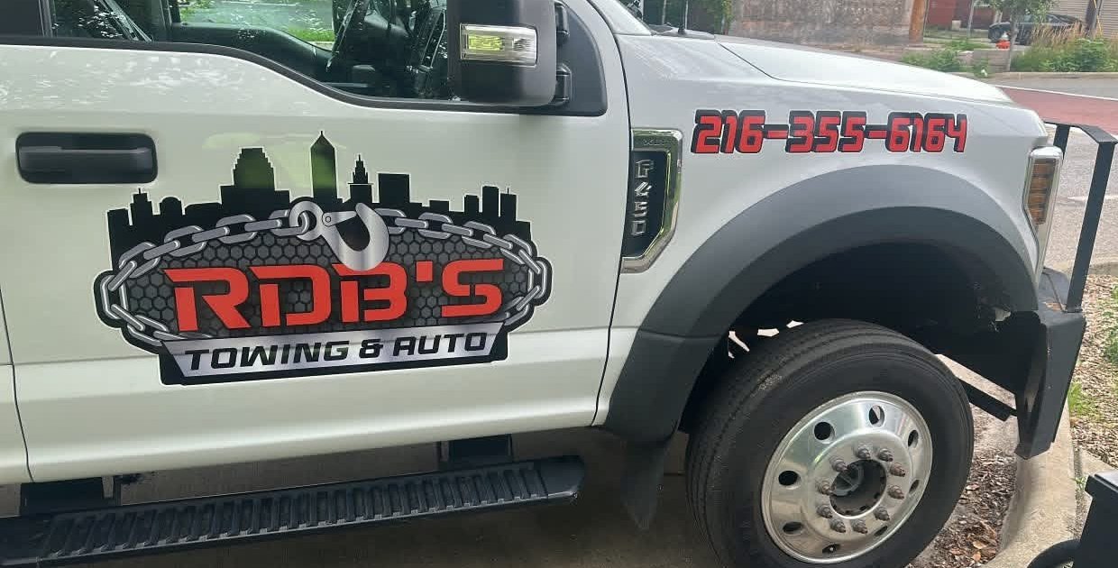 RDB's Towing & Auto flatbed truck with the Cleveland skyline logo on the door